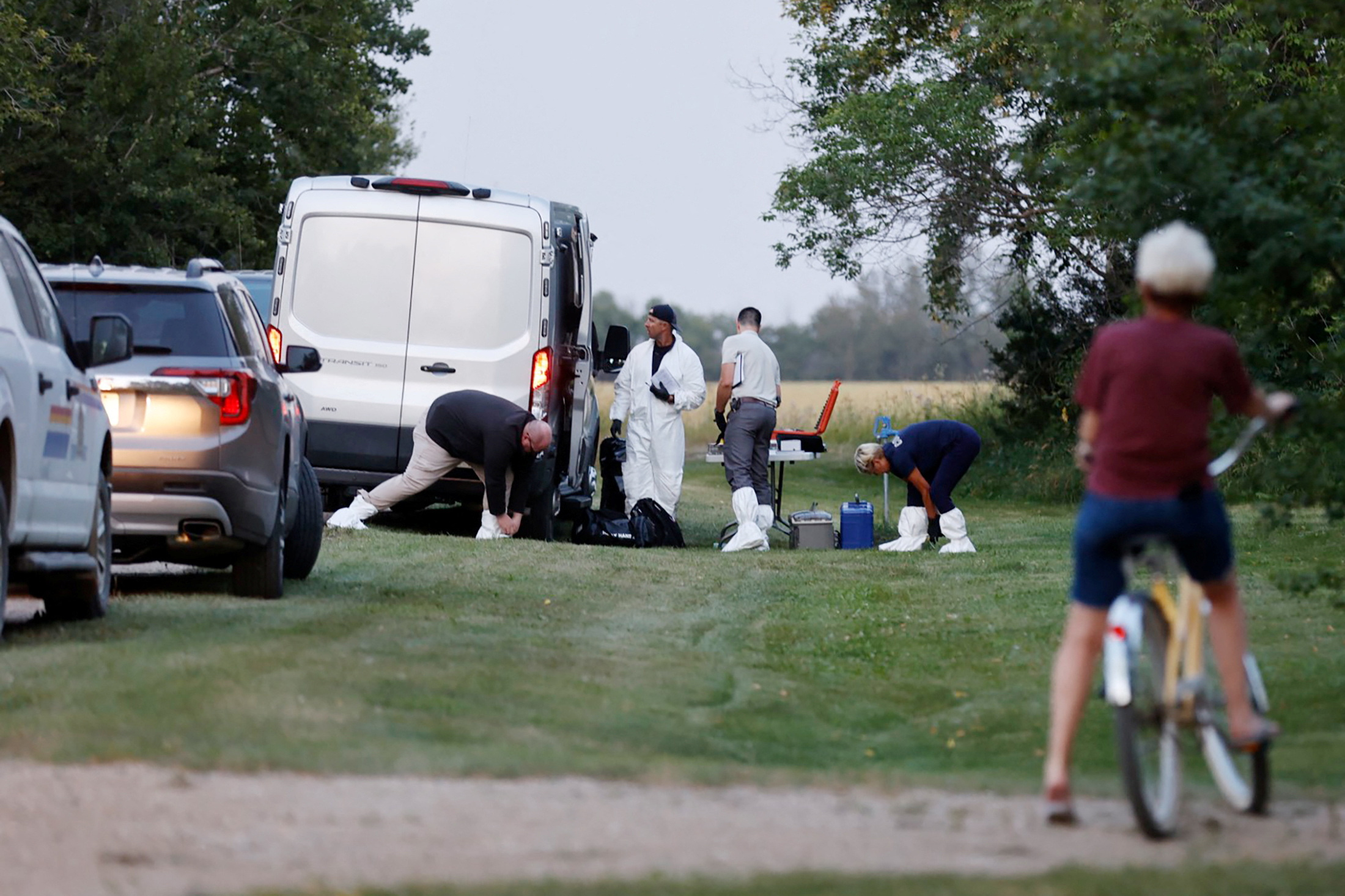 PHOTO: A police forensics team investigates a crime scene after multiple people were killed and injured in a stabbing spree in Weldon, Saskatchewan, Sept. 4, 2022.