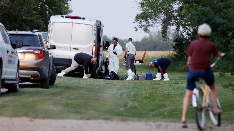 PHOTO: A police forensics team investigates a crime scene after multiple people were killed and injured in a stabbing spree in Weldon, Saskatchewan, Sept. 4, 2022.
