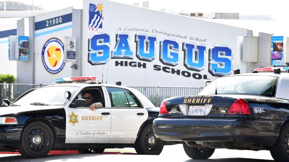 PHOTO: An officer from the Los Angeles Sheriff's Department sits in a vehicle in front of Saugus High School, Nov. 15, 2019, in Santa Clarita, Calif.