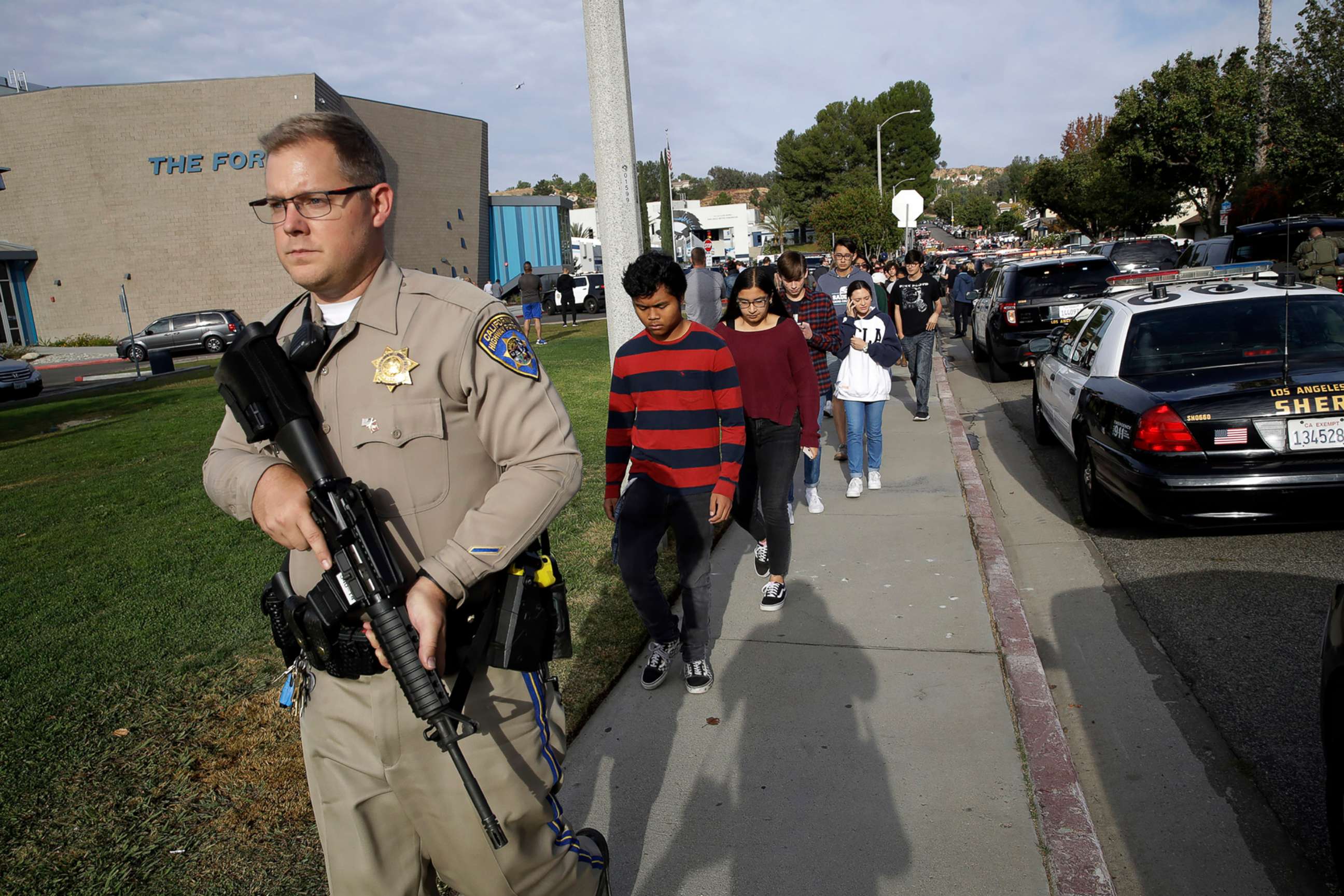 PHOTO: Students are escorted out of Saugus High School after reports of a shooting on  Nov. 14, 2019, in Santa Clarita, Calif.