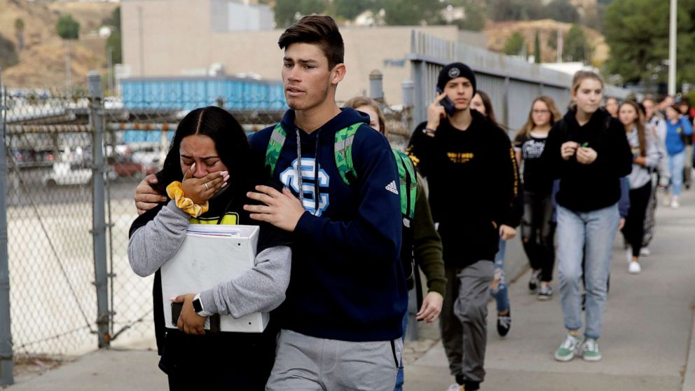 PHOTO: Students are escorted out of Saugus High School after reports of a shooting, Nov. 14, 2019, in Santa Clarita, Calif.