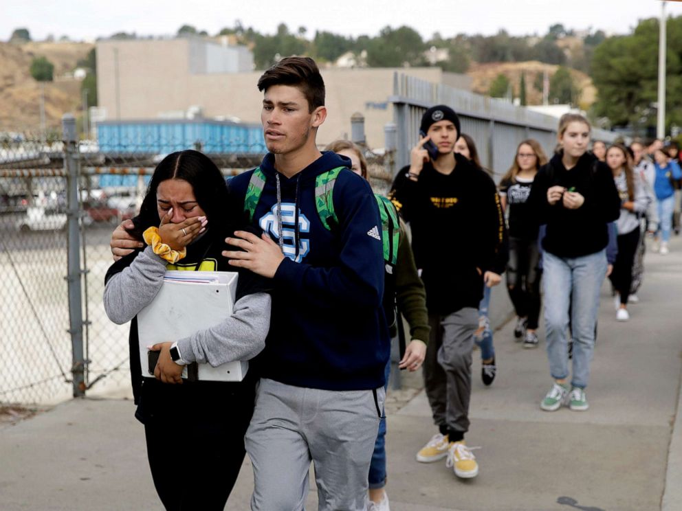 PHOTO: Students are escorted out of Saugus High School after reports of a shooting, Nov. 14, 2019, in Santa Clarita, Calif.