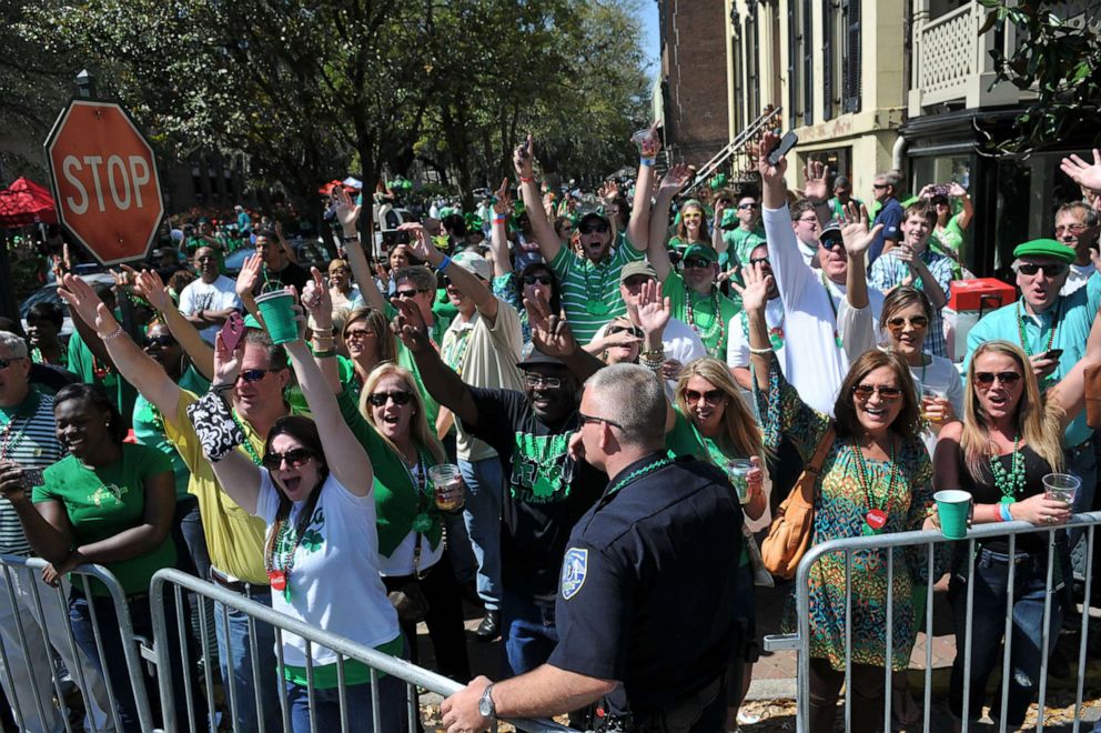 PHOTO: A large crowd cheers as the Savannah St. Patrick's Day Parade passes along Bull Street, March 16, 2013, in Savannah Ga.