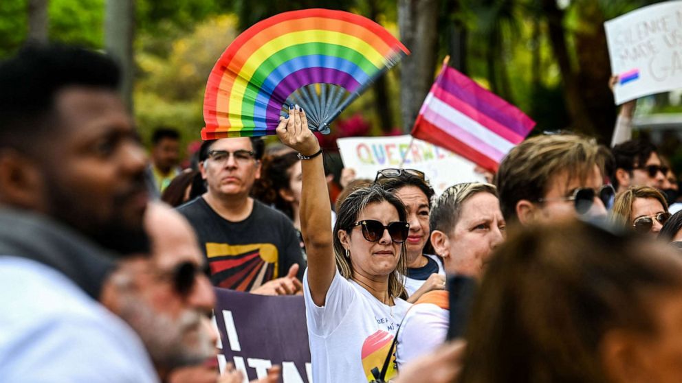 PHOTO:  Members and supporters of the LGBTQ community attend the "Say Gay Anyway" rally in Miami, March 13, 2022. Florida's state senate passed a bill banning lessons on sexual orientation and gender identity in elementary schools.