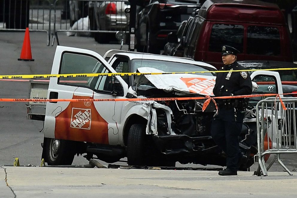PHOTO: A police officer walks past the wreckage of a Home Depot pickup truck, a day after it was used in a terror attack, Nov. 1, 2017, in New York.