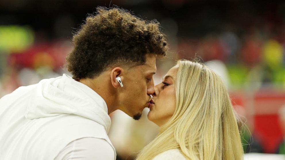 PHOTO: Kansas City Chiefs quarterback Patrick Mahomes kisses his wife Brittany Mahomes before Super Bowl LIX between the Philadelphia Eagles and the Kansas City Chiefs in New Orleans, Feb. 9, 2025.