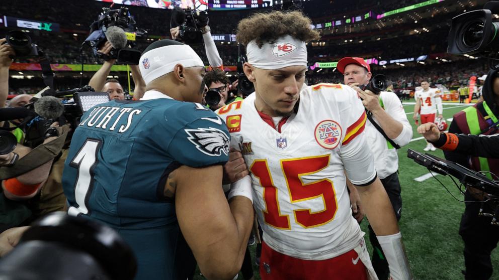 PHOTO: Philadelphia Eagles quarterback Jalen Hurts shakes hands with Kansas City Chiefs quarterback Patrick Mahomes after Philadelphia defeated Kansas City in Super Bowl LIX, Feb. 9, 2025, in New Orleans.