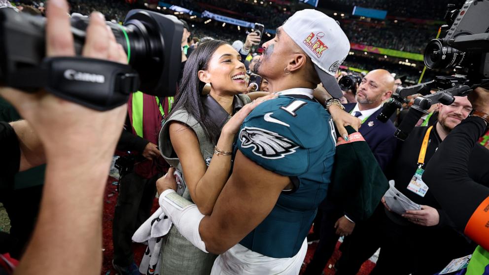 PHOTO: Philadelphia Eagles quarterback Jalen Hurts and fiancee, Bry Burrows, embrace after defeating the Kansas City Chiefs 40-22 to win Super Bowl LIX, Feb. 9, 2025 in New Orleans.