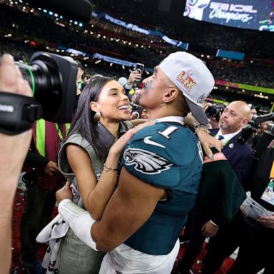 PHOTO: Philadelphia Eagles quarterback Jalen Hurts and fiancee, Bry Burrows, embrace after defeating the Kansas City Chiefs 40-22 to win Super Bowl LIX, Feb. 9, 2025 in New Orleans.