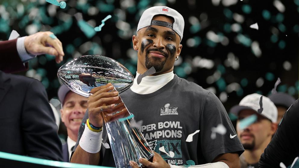 PHOTO: Philadelphia Eagles quarterback Jalen Hurts celebrates with the Vince Lombardi Trophy after defeating the Kansas City Chiefs 40-22 to win Super Bowl LIX, Feb. 9, 2025 in New Orleans.