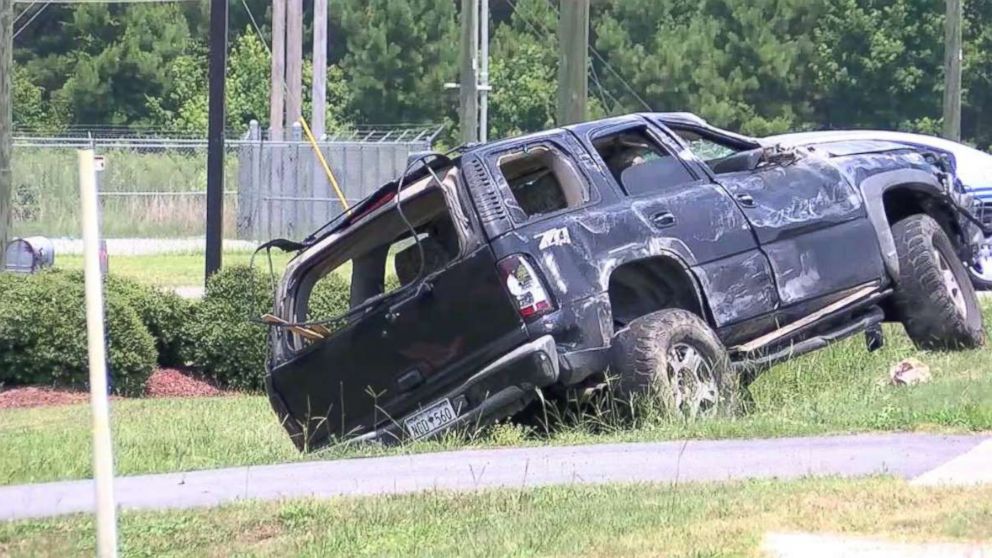 Brittany Jeffords' car sits off the side of the road after she flipped it over while fleeing police in Florence, S.C., on Friday, July 12, 2018.