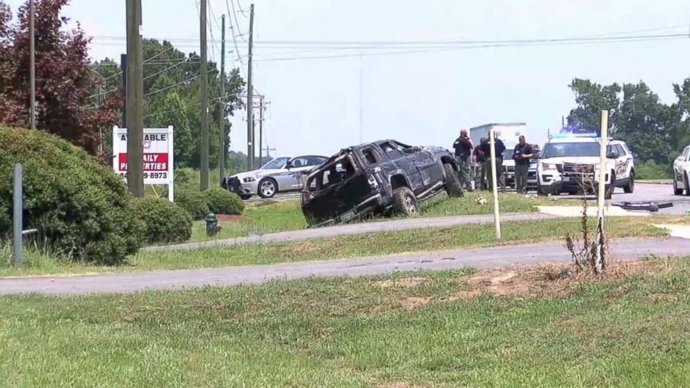 Brittany Jeffords' car sits off the side of the road after she flipped it over while fleeing police in Florence, S.C., on Friday, July 12, 2018.