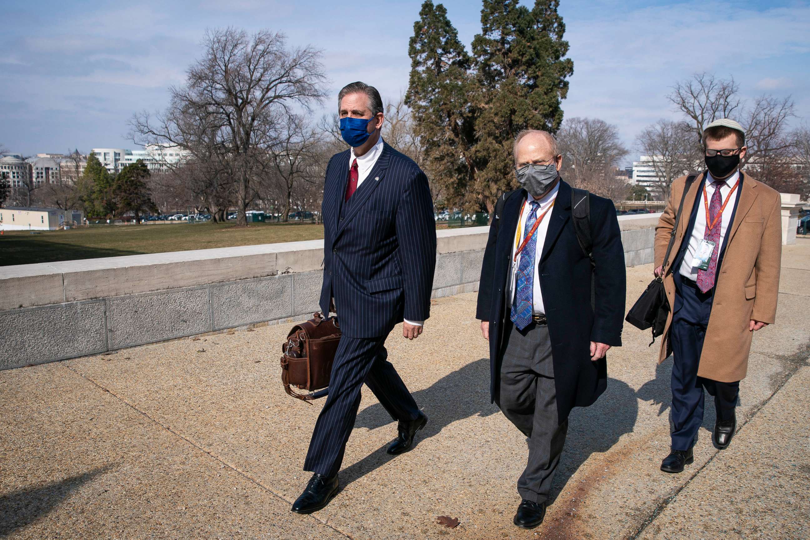 PHOTO: Bruce Castor, left, and David Schoen, center, defense attorneys for former President Donald Trump, walk to the U.S. Capitol on Feb. 10, 2021, in Washington.