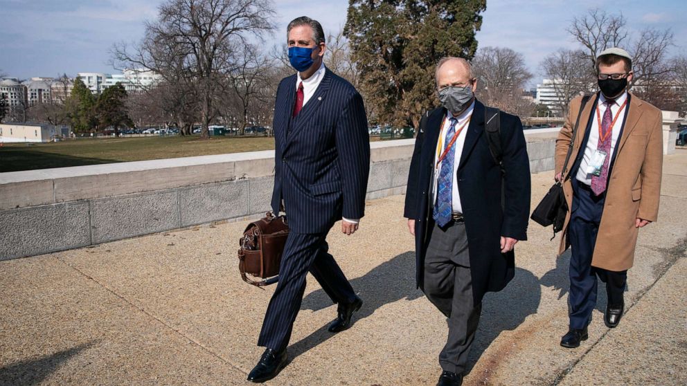 PHOTO: Bruce Castor, left, and David Schoen, center, defense attorneys for former President Donald Trump, walk to the U.S. Capitol on Feb. 10, 2021, in Washington.
