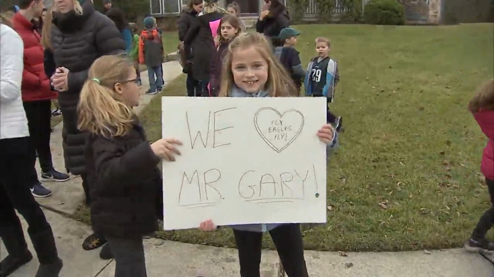 PHOTO: Some of the students that ride the school bus that Gary Kelmer drives, were waiting for him with signs.