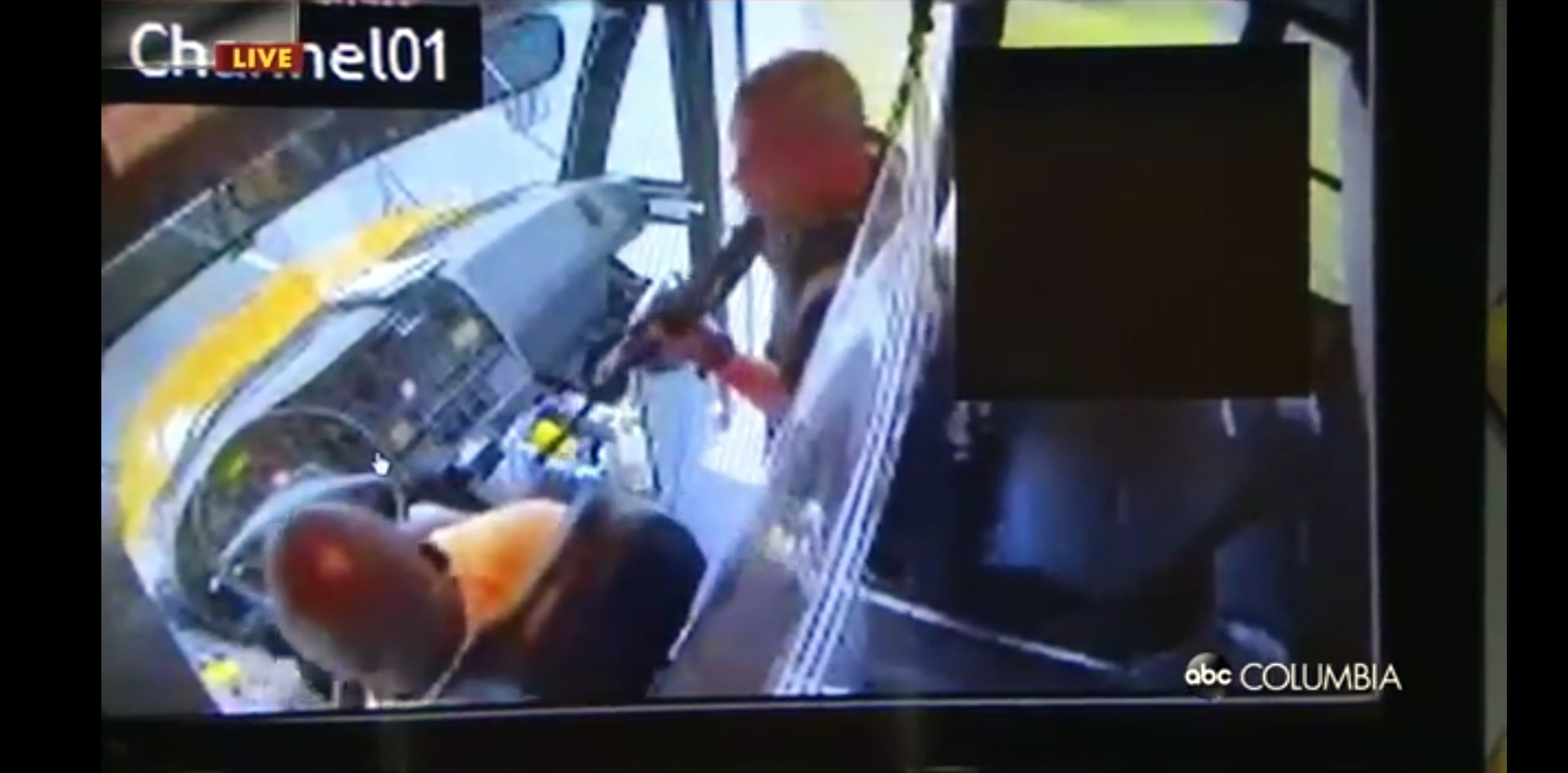 PHOTO: Surveillance video from inside the school bus shows the suspect appearing to point a rifle at the bus driver, in Richland County, S.C., May 6, 2021.