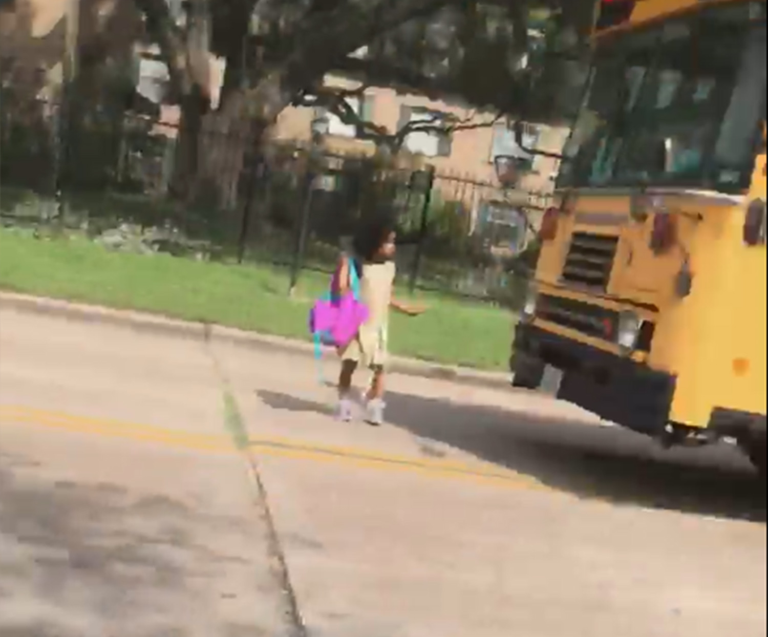 PHOTO: Houston mother Josephine Kirk-Taylor shared a video of a driver blowing past a yellow school bus' stop sign Wednesday and nearly striking her kindergarten-age daughter, Melina, as she got off the bus.