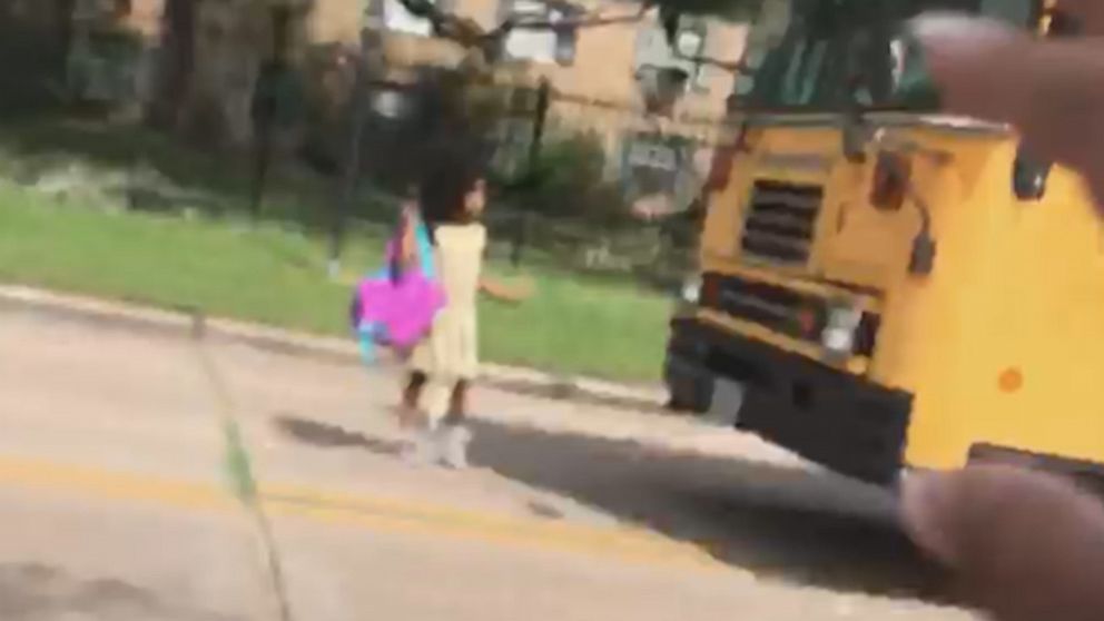 VIDEO: Car blows past school bus stop sign, nearly hitting child