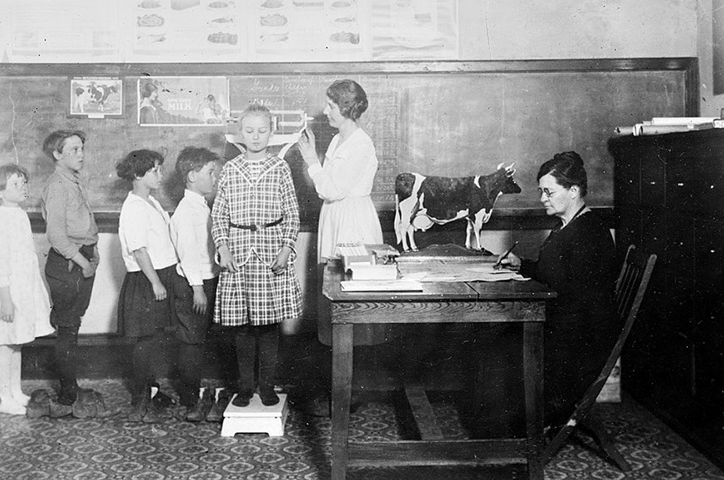 PHOTO: Schoolchildren get weighed and measured by a Red Cross nutrition worker in Cotton Plant, Arkansas, 1919.