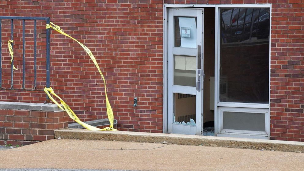 PHOTO: Broken glass at the entrance on the north side of the Central Visual and Performing Arts High School after a shooting in St Louis, Missouri, Oct. 24, 2022.