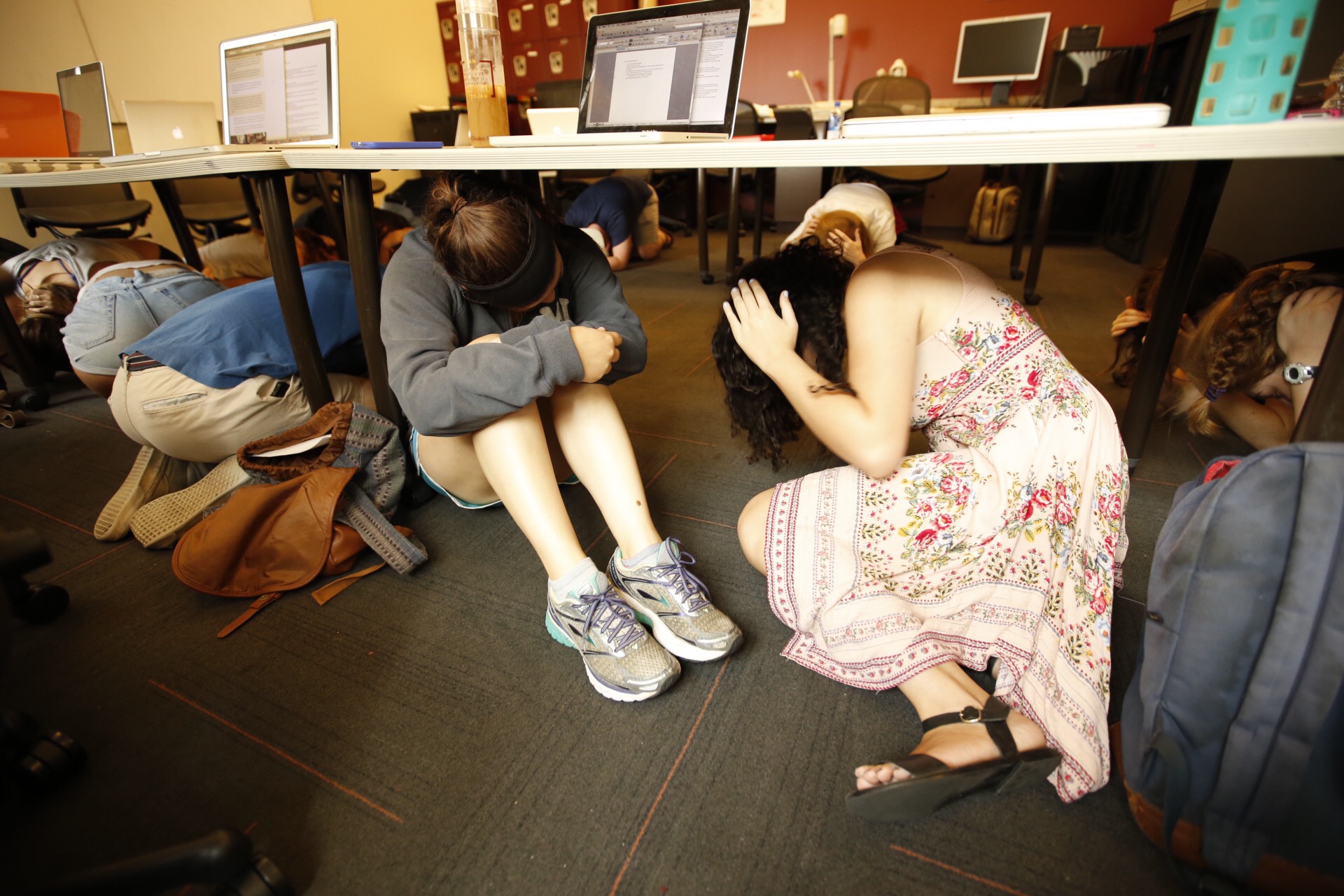 PHOTO: Students take cover under their desks during a drill in this undated stock image.