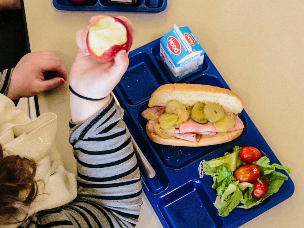 PHOTO: A student bites into an macintosh apple at Westbrook Middle School in Westrbook, M.E., on April 9, 2015.