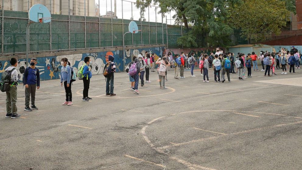 PHOTO: Students line up in the morning at Yung Wing School P.S. 124 on Sept. 27, 2021, in New York.