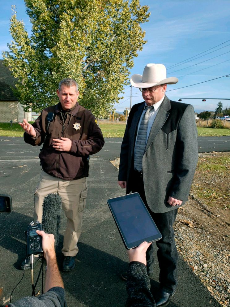 PHOTO: Lewis and Clark County Undersheriff Jason Grimmis, left, and Sheriff Leo Dutton, right, update reporters on a homemade bomb that detonated in an elementary school playground on Oct. 15, 2019, in Helena, Mont.