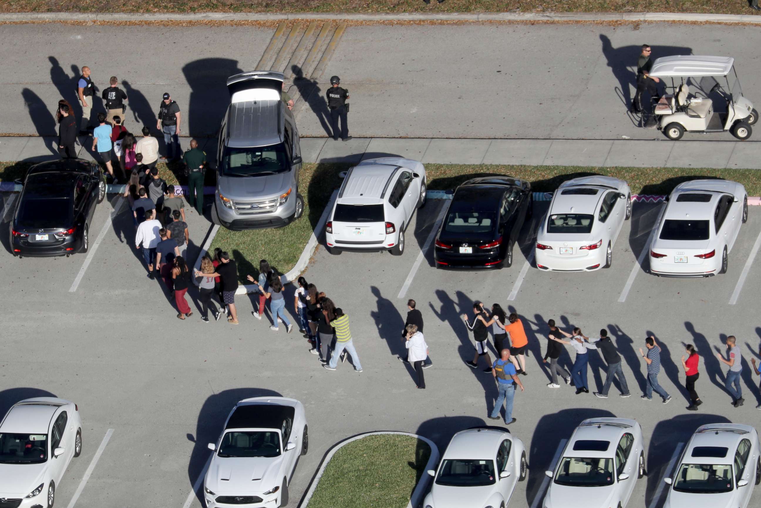 PHOTO: Students are evacuated by police from Marjory Stoneman Douglas High School in Parkland, Fla., after a mass shooting on Feb. 14, 2018.