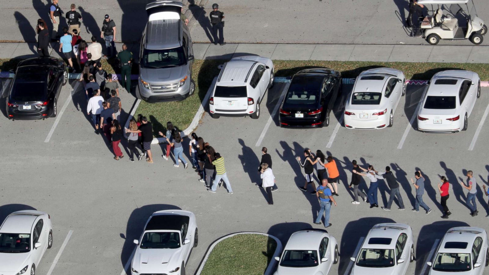 PHOTO: Students are evacuated by police from Marjory Stoneman Douglas High School in Parkland, Fla., after a mass shooting on Feb. 14, 2018.