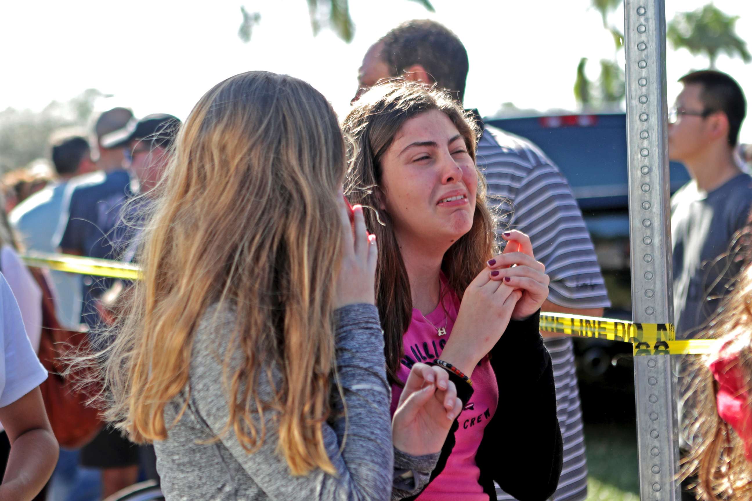 PHOTO: Students released from a lockdown are overcome with emotion following following a shooting at Marjory Stoneman Douglas High School in Parkland, Fla., Feb. 14, 2018.