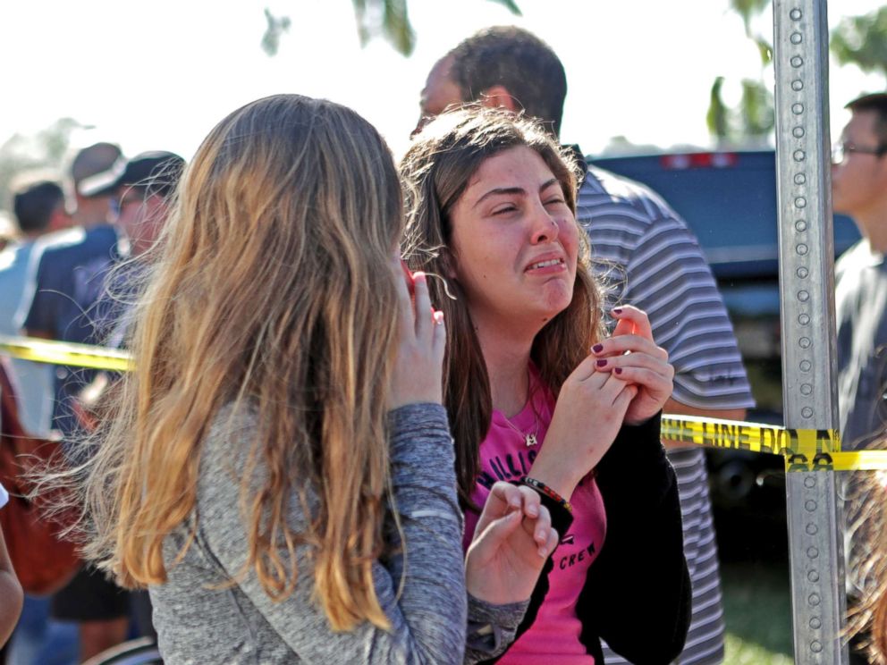 PHOTO: Students released from a lockdown are overcome with emotion following following a shooting at Marjory Stoneman Douglas High School in Parkland, Fla., Feb. 14, 2018.