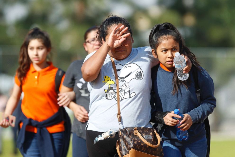 PHOTO: People pick up students after a shooting at the Salvador B. Castro Middle School near downtown Los Angeles, Feb. 1, 2018.