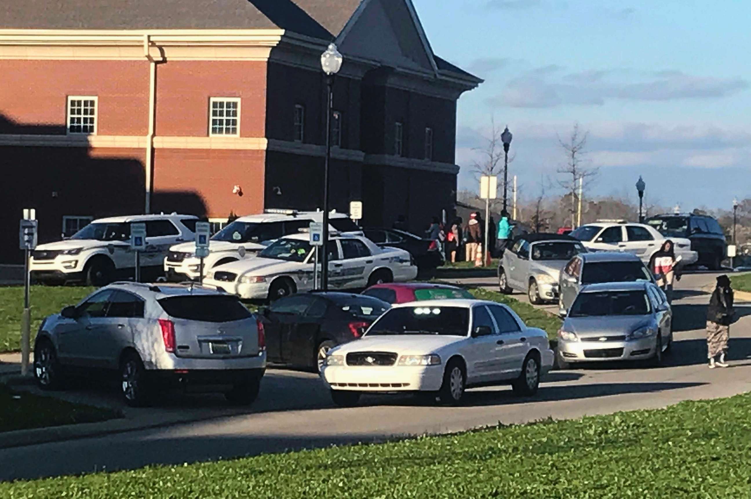 PHOTO: Authorities investigate the scene where a shooting occurred at Huffman High School, March 7, 2018, in Birmingham, Ala.