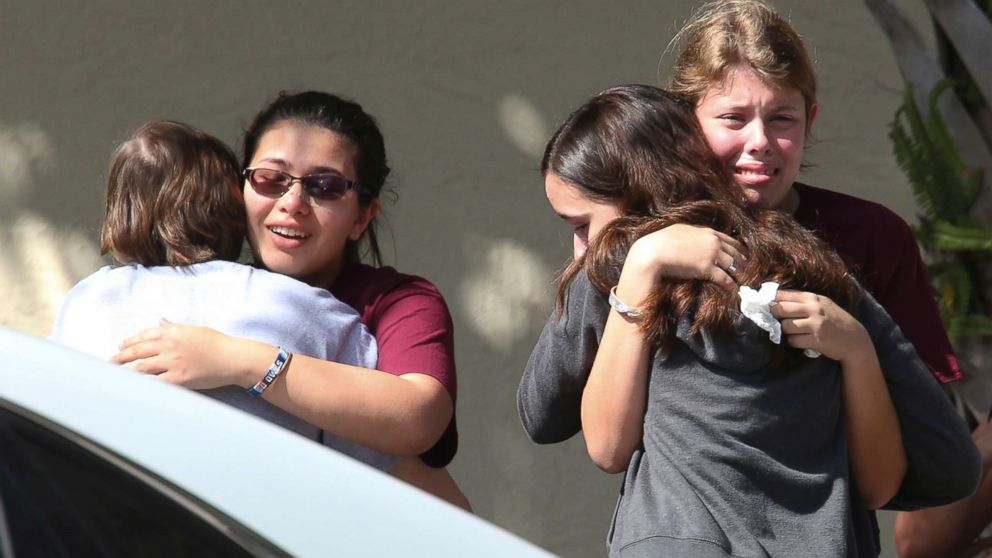 Students grieve outside Pines Trail Center where counselors are present, Feb. 15, 2018, a day after the mass shooting at Marjory Stoneman Douglas High School in Parkland, Fla.