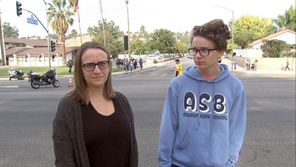 PHOTO: Lisa Eichensehr and her son, sophomore Adam, talk to the media about the school shooting at Saugus High School in Santa Clarita, Calif., near Los Angeles, Nov. 14, 2019.