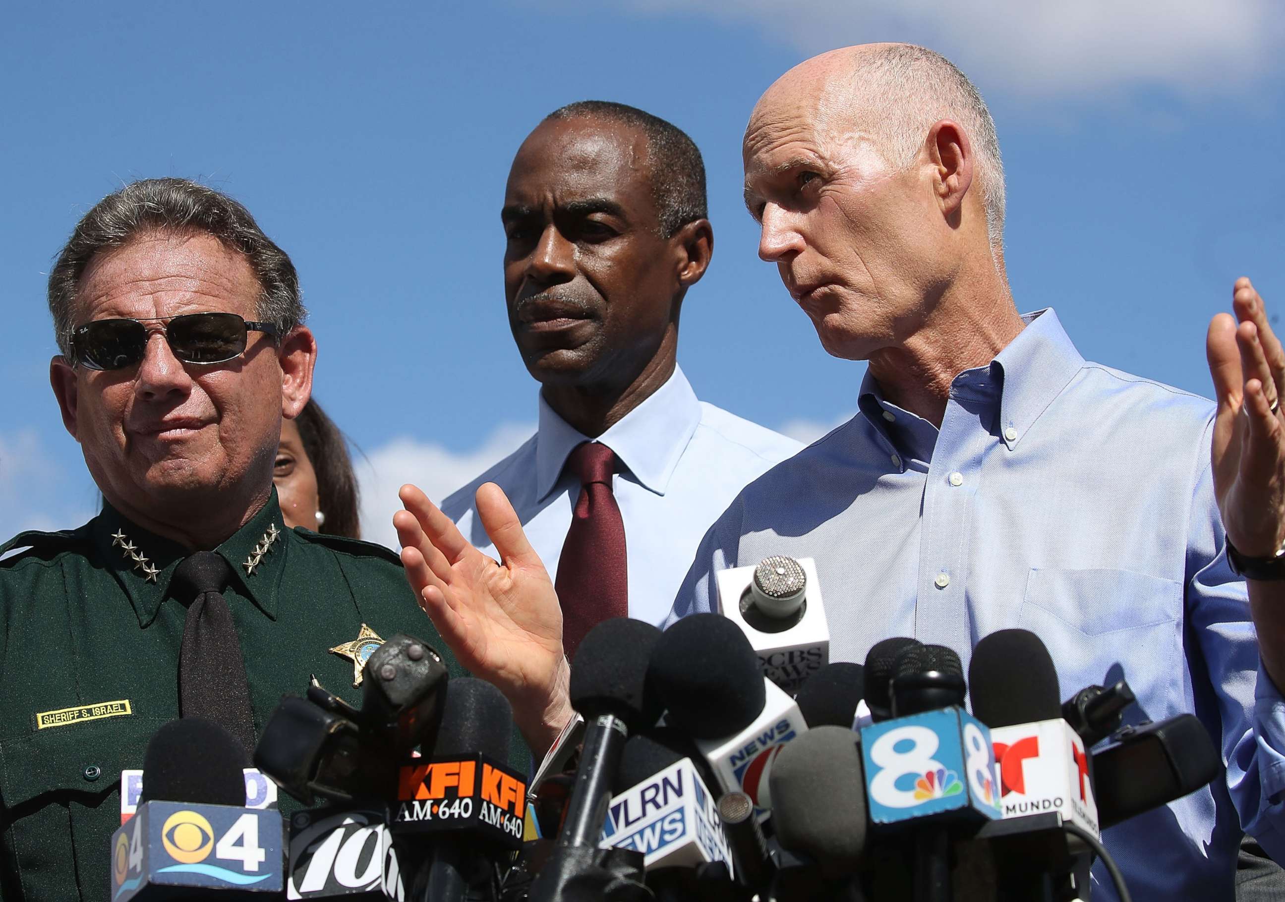 PHOTO: Florida Governor Rick Scott, speaks to the media while Superintendent Robert W. Runcie and Sheriff Scott Israel look on at a press conference about a mass shooting at Marjory Stoneman Douglas High School, Feb. 15, 2018 in Parkland, Fla.