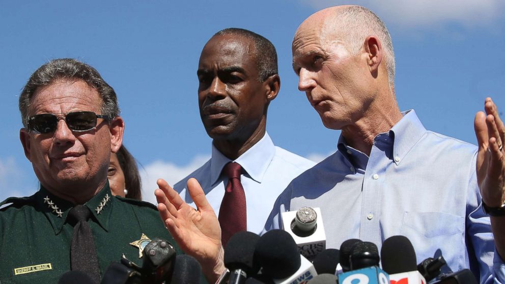 PHOTO: Florida Governor Rick Scott, speaks to the media while Superintendent Robert W. Runcie and Sheriff Scott Israel look on at a press conference about a mass shooting at Marjory Stoneman Douglas High School, Feb. 15, 2018 in Parkland, Fla.