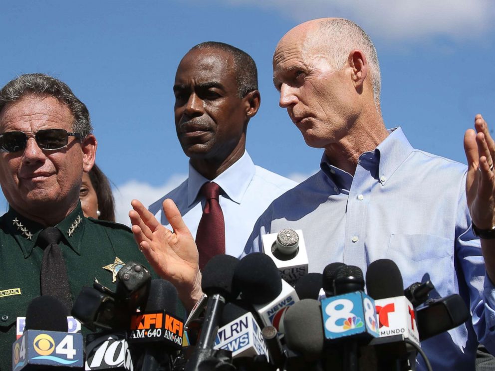 PHOTO: Florida Governor Rick Scott, speaks to the media while Superintendent Robert W. Runcie and Sheriff Scott Israel look on at a press conference about a mass shooting at Marjory Stoneman Douglas High School, Feb. 15, 2018 in Parkland, Fla.