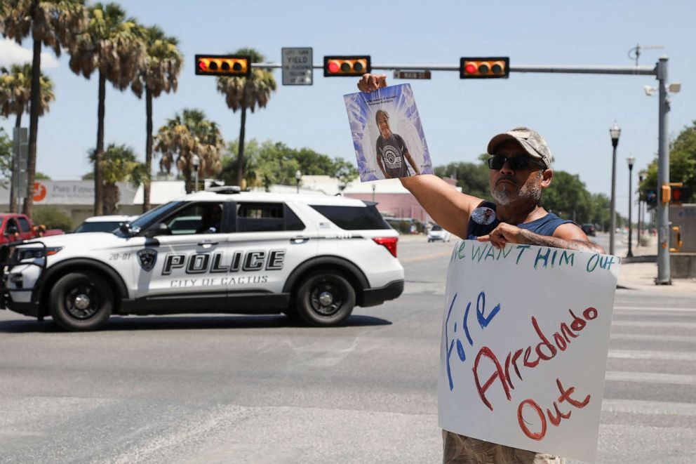 PHOTO: Jessie Rodriguez, the father of Robb Elementary School shooting victim Annabell Guadalupe Rodriguez, 10, holds a photo of her as he protests for the removal of Uvalde schools Police Chief Pete Arredondo at Uvalde Town Square, Texas, June 11, 2022. 