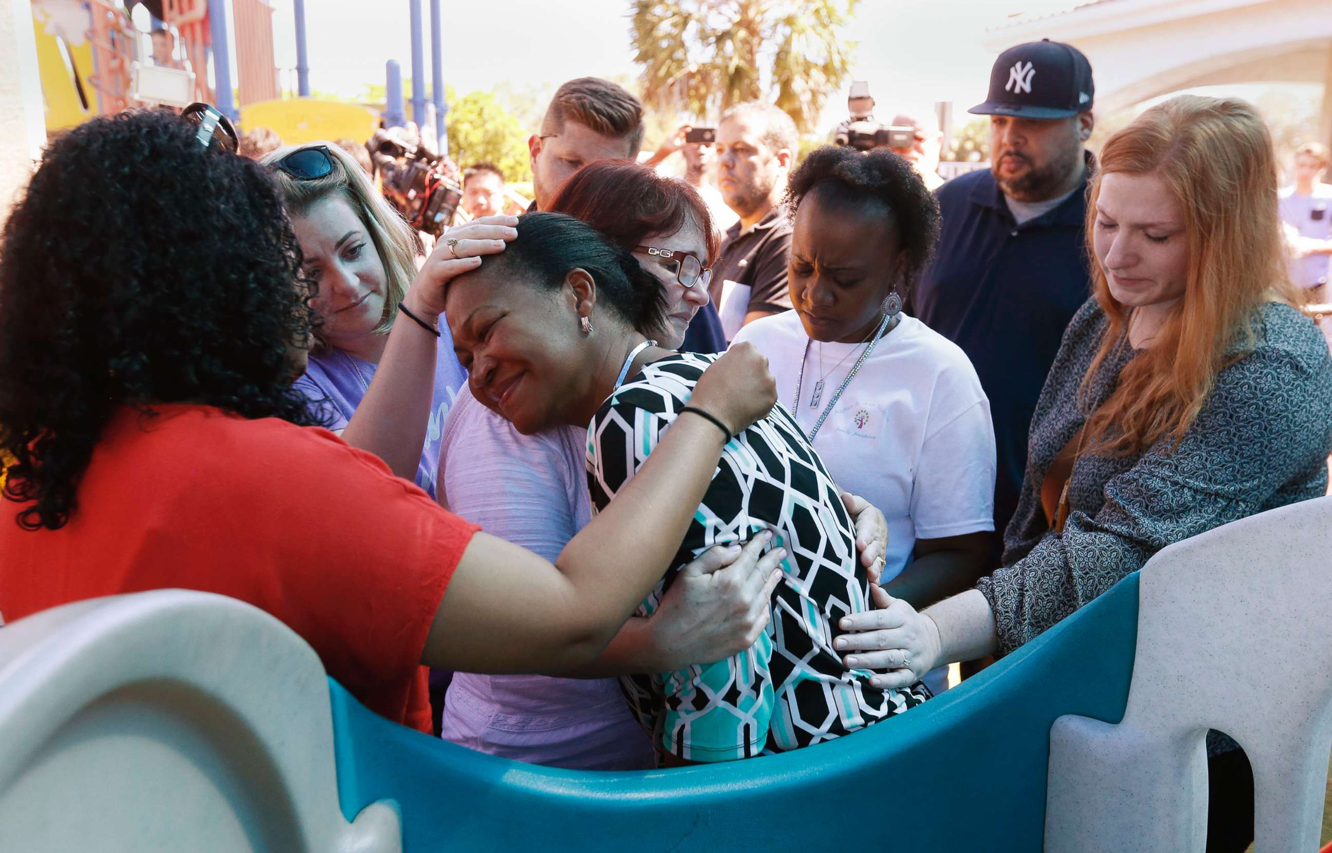 PHOTO: People comfort each other at a prayer vigil for the victims of the shooting at Marjory Stoneman Douglas High School at the Parkland Baptist Church, Feb. 15, 2018.