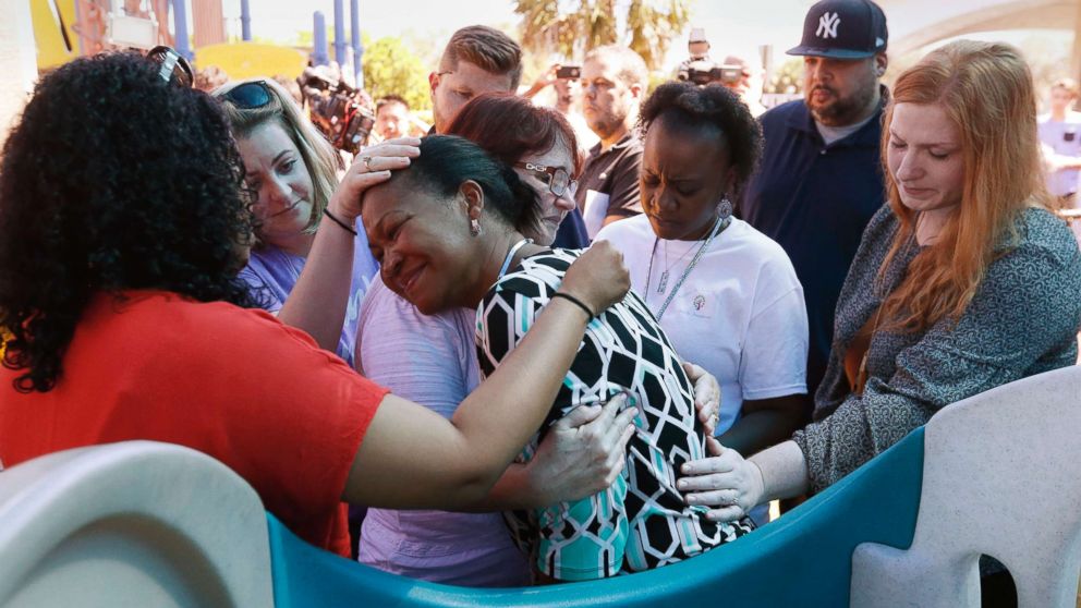 PHOTO: People comfort each other at a prayer vigil for the victims of the shooting at Marjory Stoneman Douglas High School at the Parkland Baptist Church, Feb. 15, 2018.