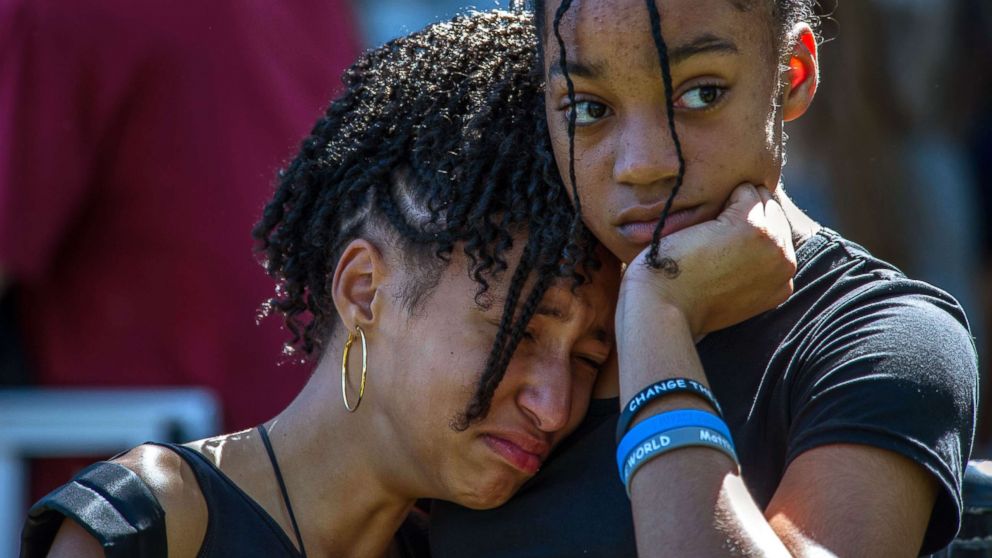 PHOTO: From left, Jalina Kohen and Brianna Hall join hundreds of community members at a prayer vigil at Parkridge Church, in Parkland, Fla., Feb. 15, 2018. 