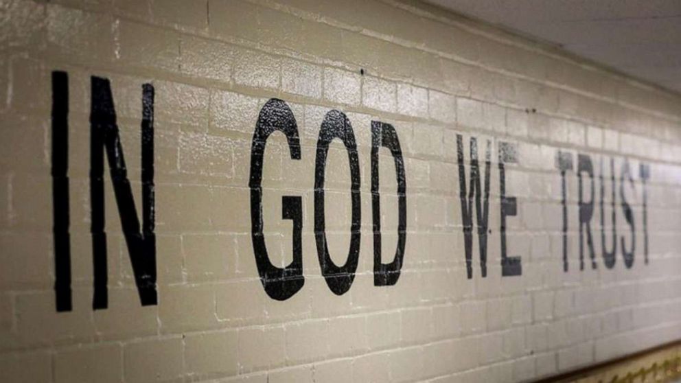 PHOTO: This July 23, 2019 photo shows "In God We Trust" stenciled in a wall at South Park Elementary in Rapid City, S.D.