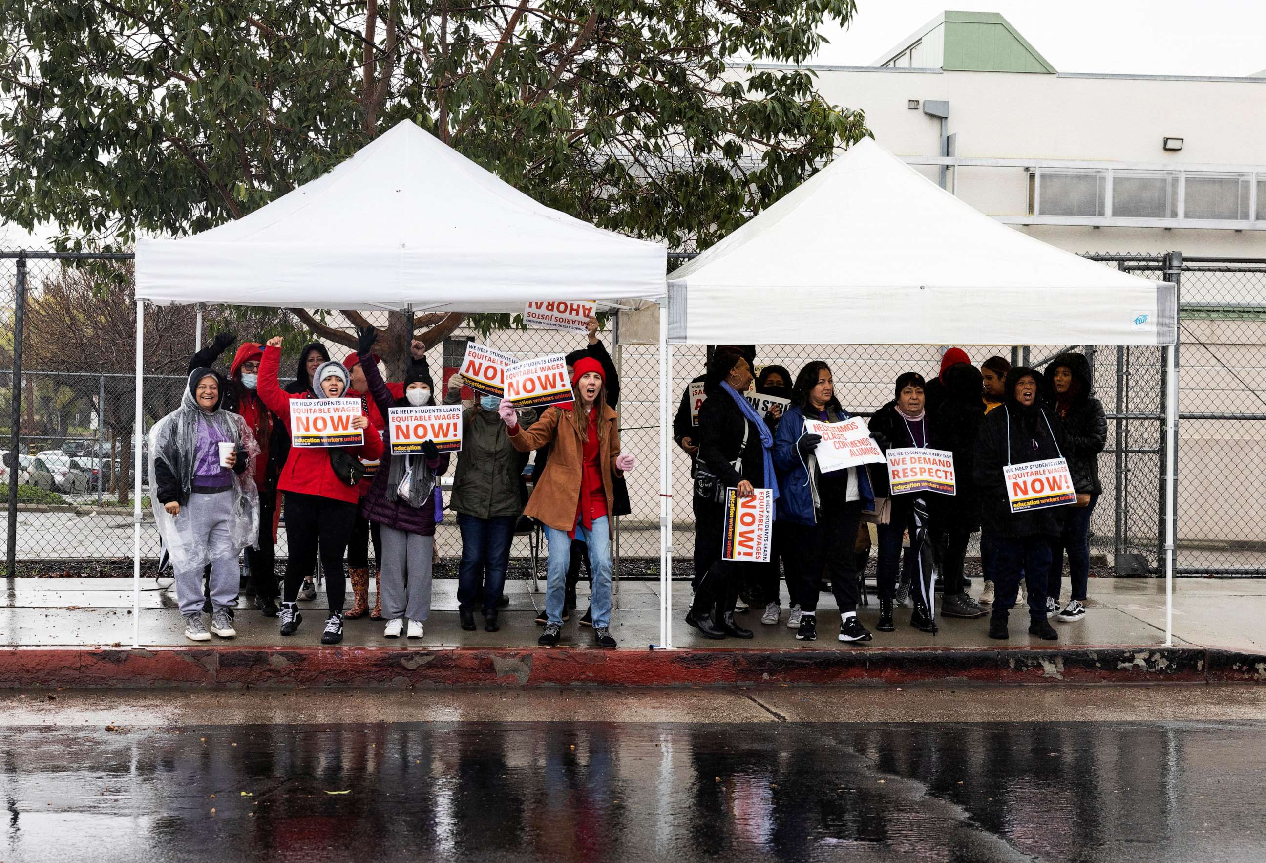 PHOTO: Los Angeles school workers protest in front of Buchanan Street Elementary School during the first day of a walkout over contract negotiations that closes the country's second largest school system in Los Angeles. Mar. 21, 2023.