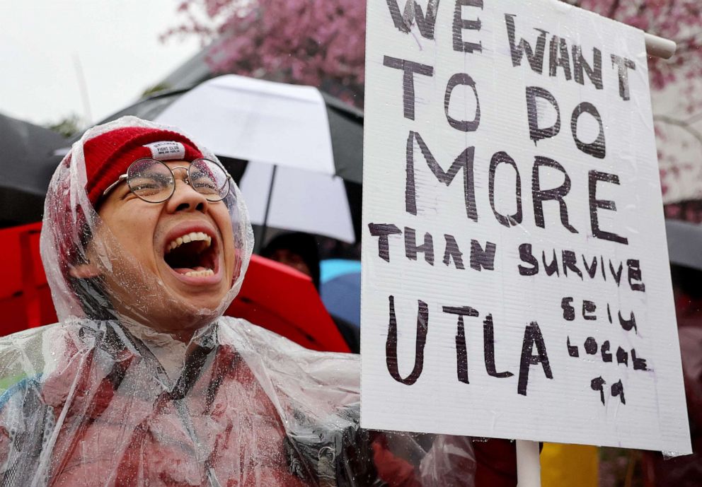 PHOTO: Mathematics teacher demonstrates in solidarity as Los Angeles Unified School District (LAUSD) workers and supporters picket outside Robert F. Kennedy Community Schools on a strike over a new contract on March 21, 2023 in Los Angeles.