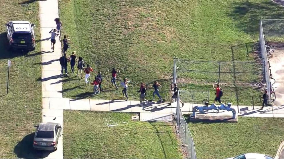 PHOTO: Students are evacuated from Marjory Stoneman Douglas High School after a shooting in Parkland, Fla., Feb. 14, 2018.