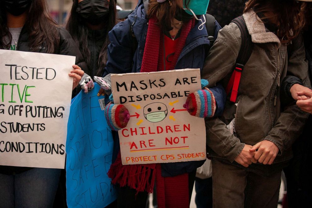 PHOTO: Students gather outside of Chicago Public Schools headquarters to stage one of several mass "Walkout for COVID Safety" at high schools due to the spread of Omicron, in Chicago on Jan. 14, 2022.