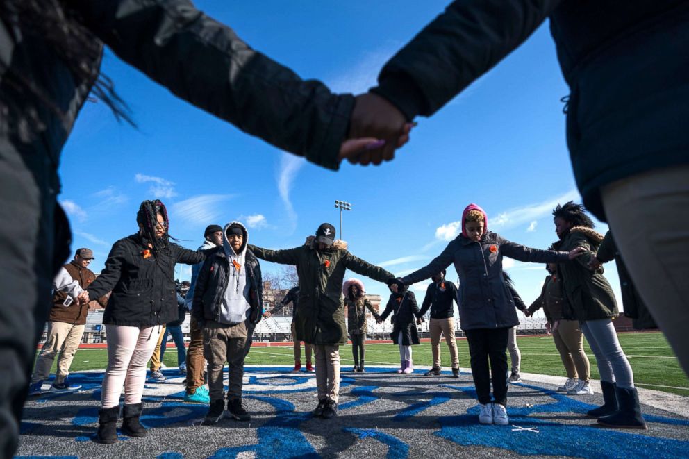 PHOTO: Eastern High School students walk out of class and assemble on their football field for the National School Walkout, a nation-wide protest against gun violence, in Washington, on March 14, 2018. 