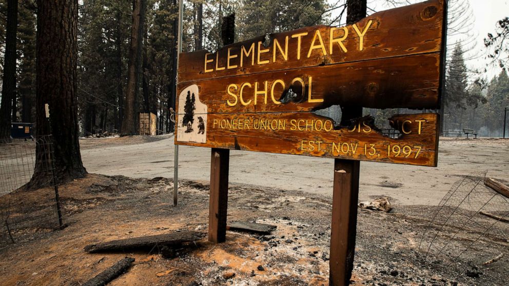 PHOTO: The burned sign to Walt Tyler Elementary School, is pictured on Aug. 18, 2021, in Grizzly Flats, Calif. The area was destroyed in the Caldor Fire.